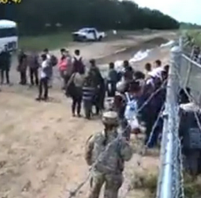 TRAITOR BITCH SOLDIER LETS ILLEGAL INVADERS THROGUH GATE INTO U.S. edited